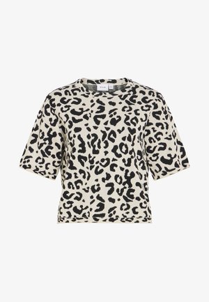 Haut en tricot à manches courtes avec motif léopard noir et blanc et col rond.