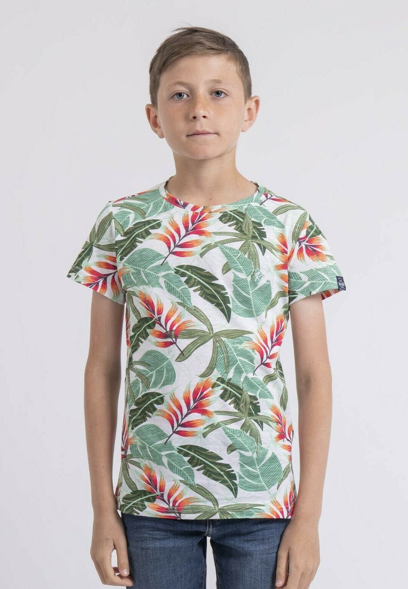 T-shirt à manches courtes en coton, présentant un motif floral tropical avec des feuilles vertes et des fleurs rouges et orangées vibrantes sur un fond blanc.