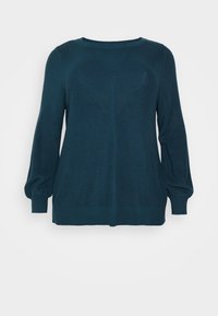 Sweter w kolorze morskim, wykonany na drutach, z długimi balonowymi rękawami, ściągaczami na mankietach i dole. Na przodzie zdobiony teksturowanym wzorem diamentowym.