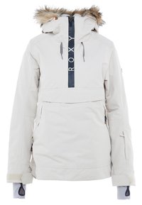 Hellgraue, isolierte Jacke mit einem mit Fell besetzten Kapuzenrand, vorderem Reißverschluss und Roxy-Logo. Verfügt über seitliche Reißverschluss-Taschen und verstellbare Bündchen.