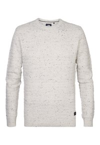 White knitted sweater with a textured pattern and black speckles. Features a round neckline and ribbed cuffs and hem.