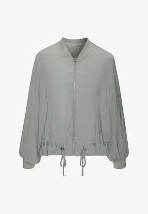 Bomber grigio chiaro con zip frontale, polsini elastici, due tasche laterali e orlo regolabile con coulisse. Finitura morbida e strutturata.