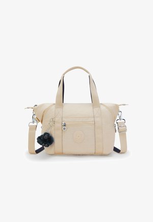 Sac à main beige avec deux poignées, une poche avant zippée, une bandoulière réglable et un petit porte-clés singe en peluche noir attaché.