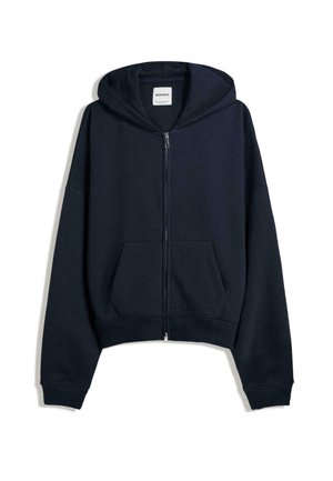 Navy blue cropped hoodie made of soft fabric. Features a front zipper, large front pockets, and a drawstring hood. Simple design.