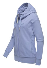 Felpa con zip blu chiaro in tessuto morbido, dotata di un ampio cappuccio, polsini a costine e tasche laterali. Include lacci testurizzati e dettaglio del logo.
