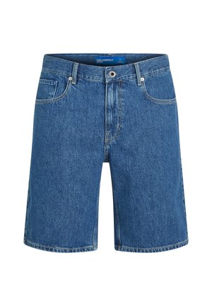 Sinised teksapüksid sirge lõikega, viie tasku ja nähtava õmblusega. Varustatud ees nööpidega sulgumise ja vöökoha sildiga.