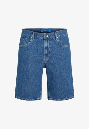 Sinised teksapüksid sirge lõikega, viie tasku ja nähtava õmblusega. Varustatud ees nööpidega sulgumise ja vöökoha sildiga.