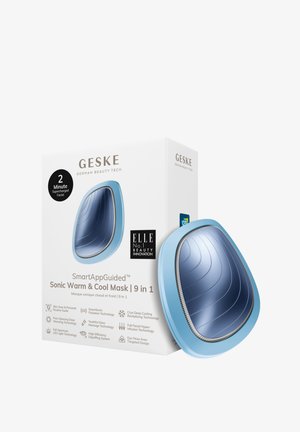 Masque Sonic Warm & Cool avec un extérieur bleu incurvé et une surface intérieure texturée en argent. Emballé dans une boîte compacte contenant les détails du produit.