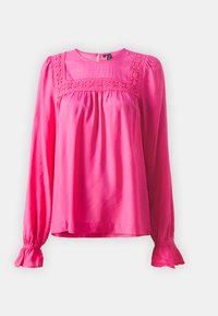 Blusa rosa a maniche lunghe con scollatura tonda, dotata di dettagli in pizzo lungo il corpo e polsini arricciati. Tessuto morbido.