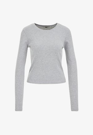 Grå långärmad skjorta i en texturerad bomullsblandning, med en rund ringning och en åtsittande passform. Inga synliga mönster eller dekorationer.