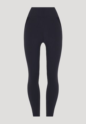 Marinefarbene Leggings mit hohem Bund, aus einem glatten, dehnbaren Stoff hergestellt. Verfügt über zwei Seitentaschen und dezente Rippdetails.