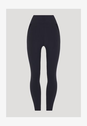 Marinefarbene Leggings mit hohem Bund, aus einem glatten, dehnbaren Stoff hergestellt. Verfügt über zwei Seitentaschen und dezente Rippdetails.