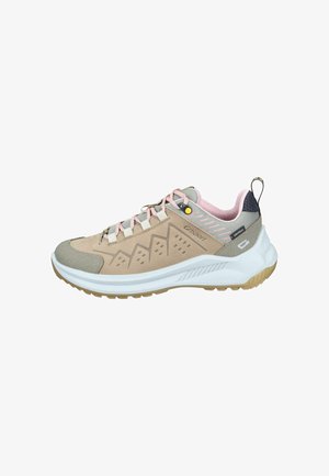 Beige and gray athletic shoe with pink laces, textured panels, and a white sole. Features a pull tab and perforated design on the side.