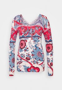 Pull à col en V à manches longues, de couleur crème, avec un imprimé floral aux couleurs bleues et rouges, présentant des motifs complexes et une texture côtelée.