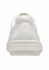 White sneaker with a textured mesh upper, rounded collar, and a solid rubber sole. Rear view shows minimalistic design and stitching details.