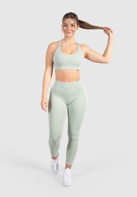Smilodox ADVANCE PRO MID RISE YOGA SPORT FITNESS - Leggings - grün