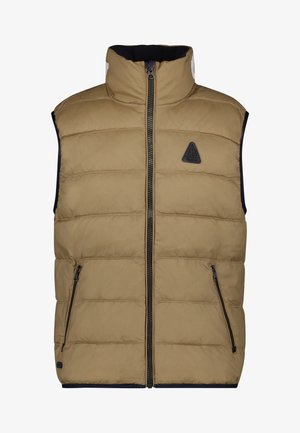 Gilet matelassé sans manches beige avec fermeture éclair frontale, deux poches zippées, col haut et petite patch logo triangulaire sur la poitrine.