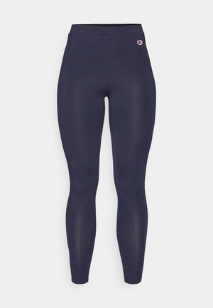 Leggings blu navy realizzati in tessuto elasticizzato, con vita alta e un piccolo logo accentato vicino all'anca. Nessun motivo o texture visibili.