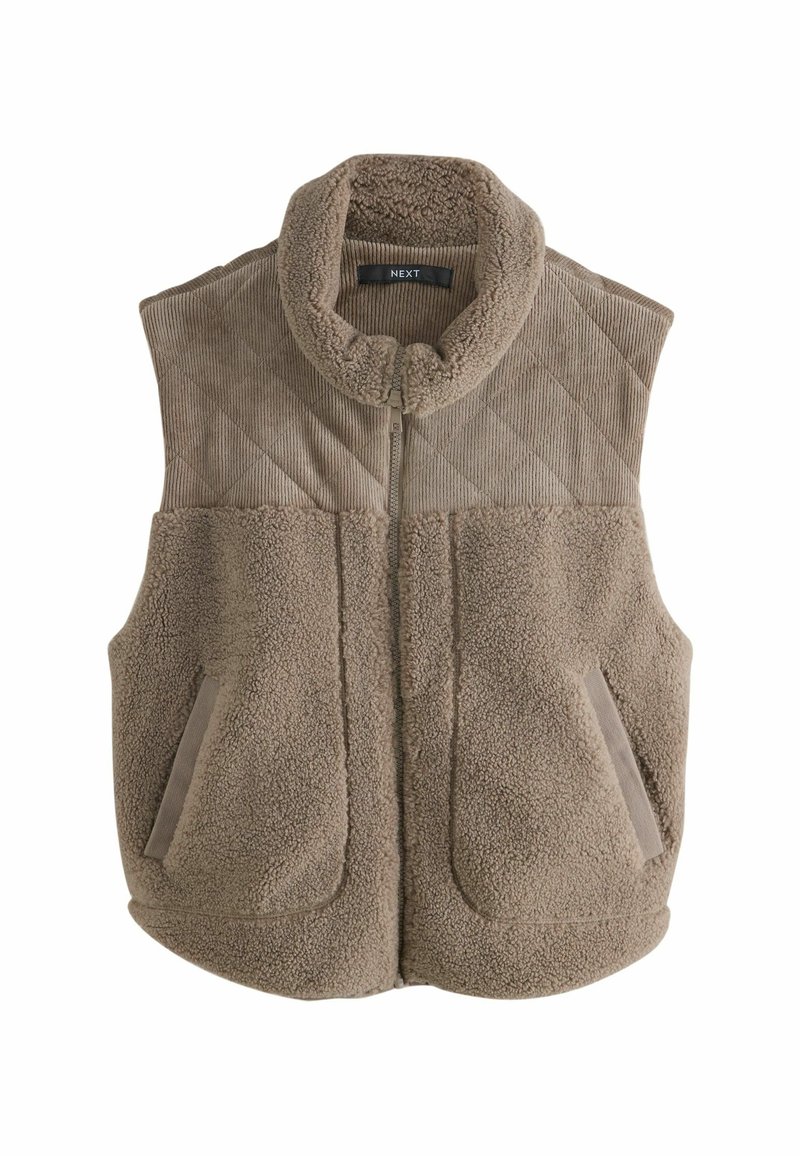 Fleece vest in beige with a high collar, quilted texture on upper and plush lower section, featuring two side pockets and a front zipper.