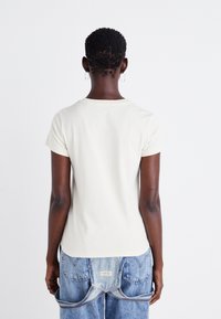 Levi's® Marškinėliai su spaudiniu - white swan