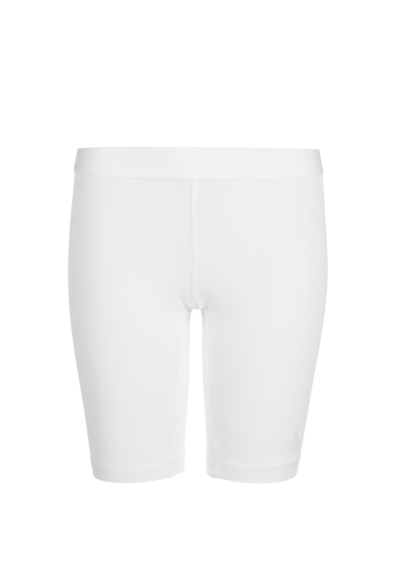 Pantaloni sportivi bianchi con un design aderente, realizzati in un tessuto liscio e elasticizzato. Presentano una cintura morbida e un branding minimale sul lato.