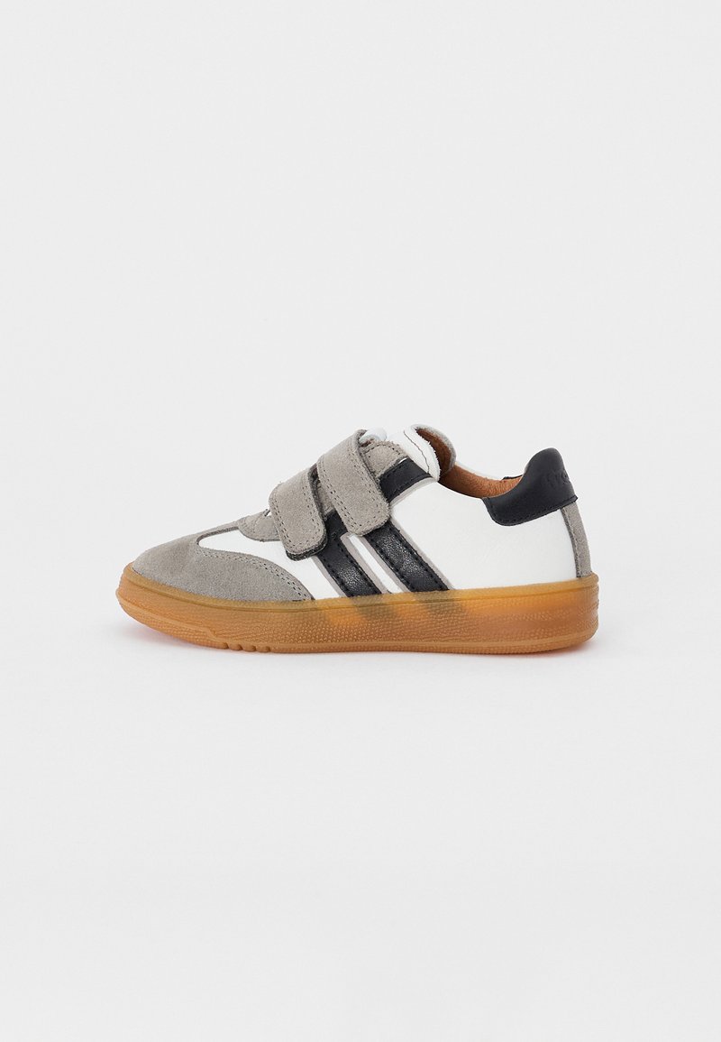Gray suede and white leather sneaker with black accents, Velcro straps, and a gum rubber sole. Features three black stripes on the side.