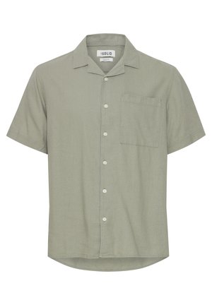 Kortermet skjorte med knapper i lysegrønn, laget av teksturert stoff. Har en brystlomme og en camp-style krage.