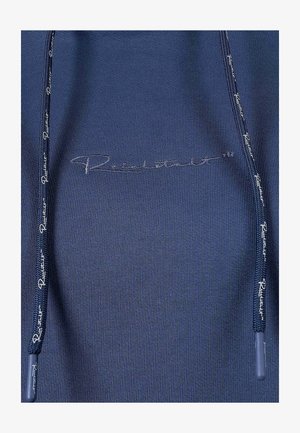 Navy sweatshirt with ribbed texture, featuring a raised embroidered logo in silver on the chest and matching drawstrings with logo details.