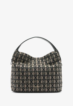 Sac en tissu texturé beige et noir avec un motif de logo. Design souple et décontracté avec une anse noire incurvée et une marquage doré.