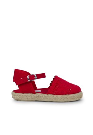 Red espadrille sandal with perforated canvas upper, scalloped edges, ankle strap with buckle, and jute-wrapped outsole.