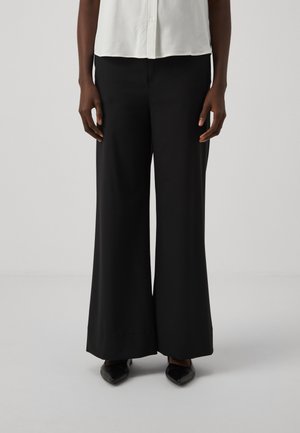 MAIN - Trousers - black