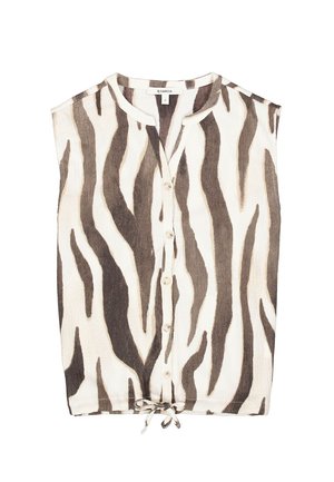 Blouse sans manches en matière légère présentant un motif zèbre crème et marron. Boutonnage devant avec un détail de nouage à l'ourlet.