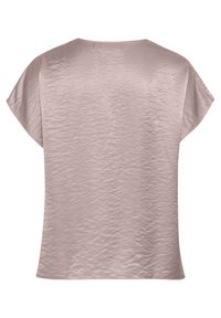 Top a maniche corte di un rosa chiaro, realizzato in un tessuto liscia e leggermente testurizzato. Presenta un collo rotondo e una vestibilità comoda.