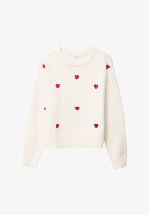 Maglione a maniche lunghe color crema con toppe a forma di cuore rosse distribuite uniformemente sul davanti e sulle maniche.