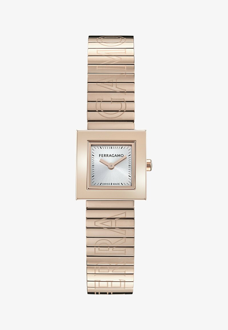 Zegarek kwarcowy z kwadratową obudową w różowym złocie, srebrną tarczą i grawerowanym logo na metalowej bransolecie. Wyprodukowano w Szwajcarii. Proste znaczniki godzinowe.