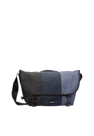 Borsa a tracolla con tracolla regolabile, pannelli a blocchi di colore in nero, blu navy e grigio, con due fibbie frontali e logo Timbuk2.