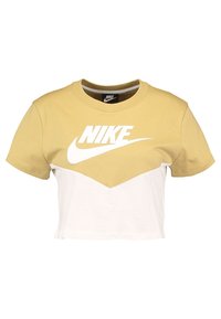 Treklippt T-shirt med ljusgul övre del och vit nedre del. Har en framträdande vit Nike-logotyp över bröstet. Tillverkad av bomullsmaterial.