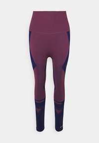 Leggings dans une combinaison de couleurs bordeaux et marine, avec une taille haute, des panneaux texturés et des accents de design géométrique.