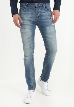 Vaqueros pitillo - stone blue denim