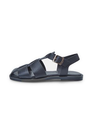 Sandal in pelle blu con cinturini incrociati, design con punta aperta e chiusura con fibbia laterale. Suola piatta con bordi cuciti a contrasto.
