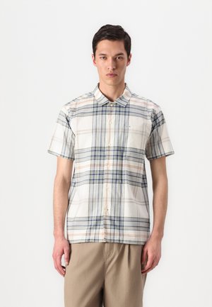 Short-sleeve plaid shirt in white, blue, and orange. Features a button-down collar, lightweight fabric, and a left chest pocket.