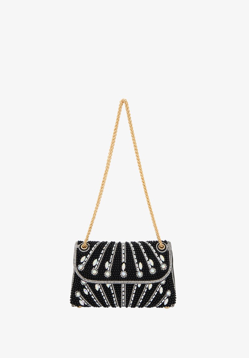 Svart pärlhandske med gyllene kedjesläp, som har en böjd design med vita ädelstensdetaljer och upphöjda linjer för textur och detalj.