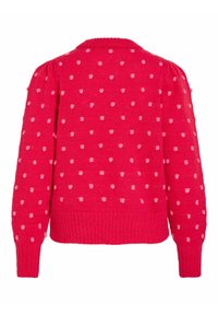 Pull rouge en tricot avec des pois rose clair, poignets et ourlet côtelés, manches longues légèrement bouffantes, vu de dos.