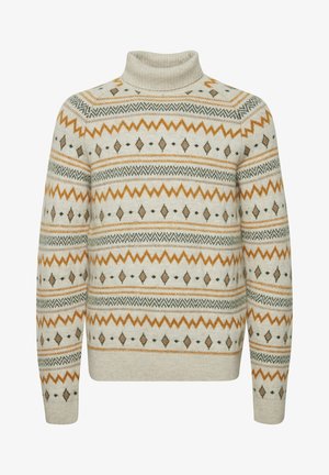 Světle béžový rolák s vzorovaným designem, který obsahuje zelené, oranžové a hnědé akcenty, včetně diamantů a cik-cak pruhů.