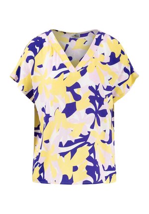 Short-sleeve blouse in lightweight fabric featuring a yellow, purple, and pink floral pattern with a V-neck design and loose fit.