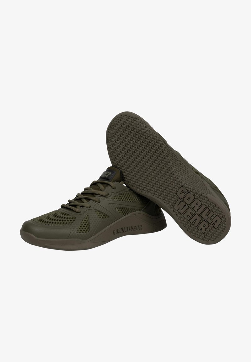 Groene mesh sneakers met een getextureerde zool, voorzien van een logo aan de zijkant en een gladde neuscap voor extra duurzaamheid.