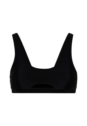 Reggiseno sportivo nero con spalline larghe, scollatura a girocollo e dettaglio a taglio sul davanti. Realizzato in tessuto liscio e elastico.