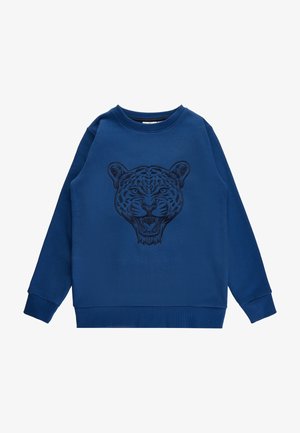Niebieska bluza wykonana z mieszanki bawełny, z haftowanym wzorem głowy tygrysa na przodzie. Prążkowany dekolt i mankiety. Luźny krój.