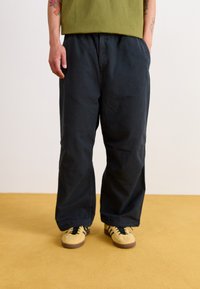 Carhartt WIP JUDD PANT - Trousers - black stone dyed