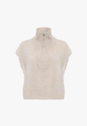 Crème kleurige fluffy korte mouwen trui met een hoge hals en een halve rits aan de voorkant, weergegeven op een witte achtergrond.